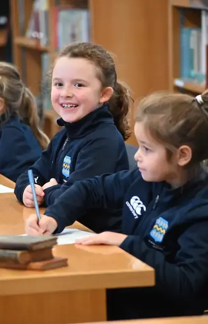 Pocklington Prep School pupil smiling a lesson in the library